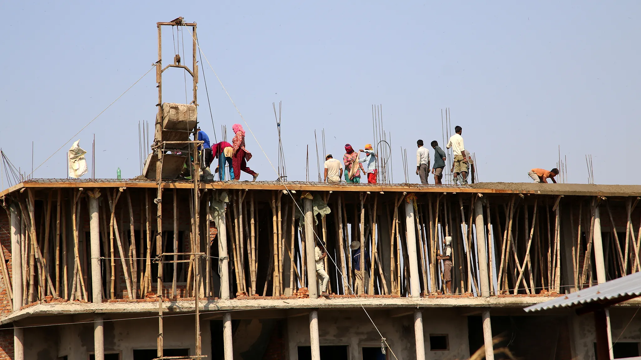 Inflation Plummets As Home Finance, workers at construction site